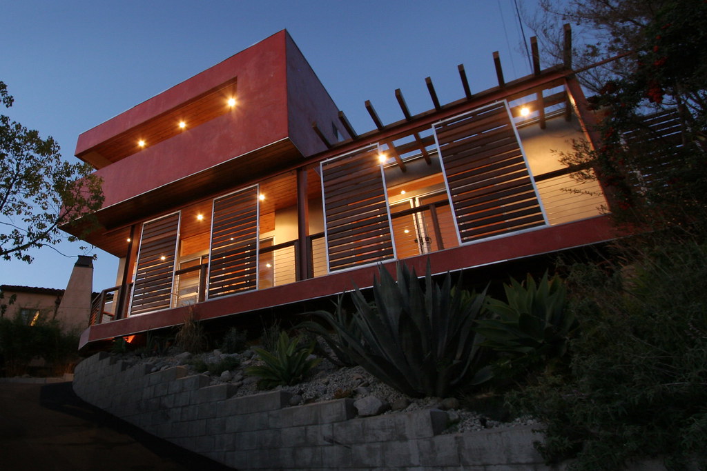 A home lit warmly at dusk, custom architectural lighting design